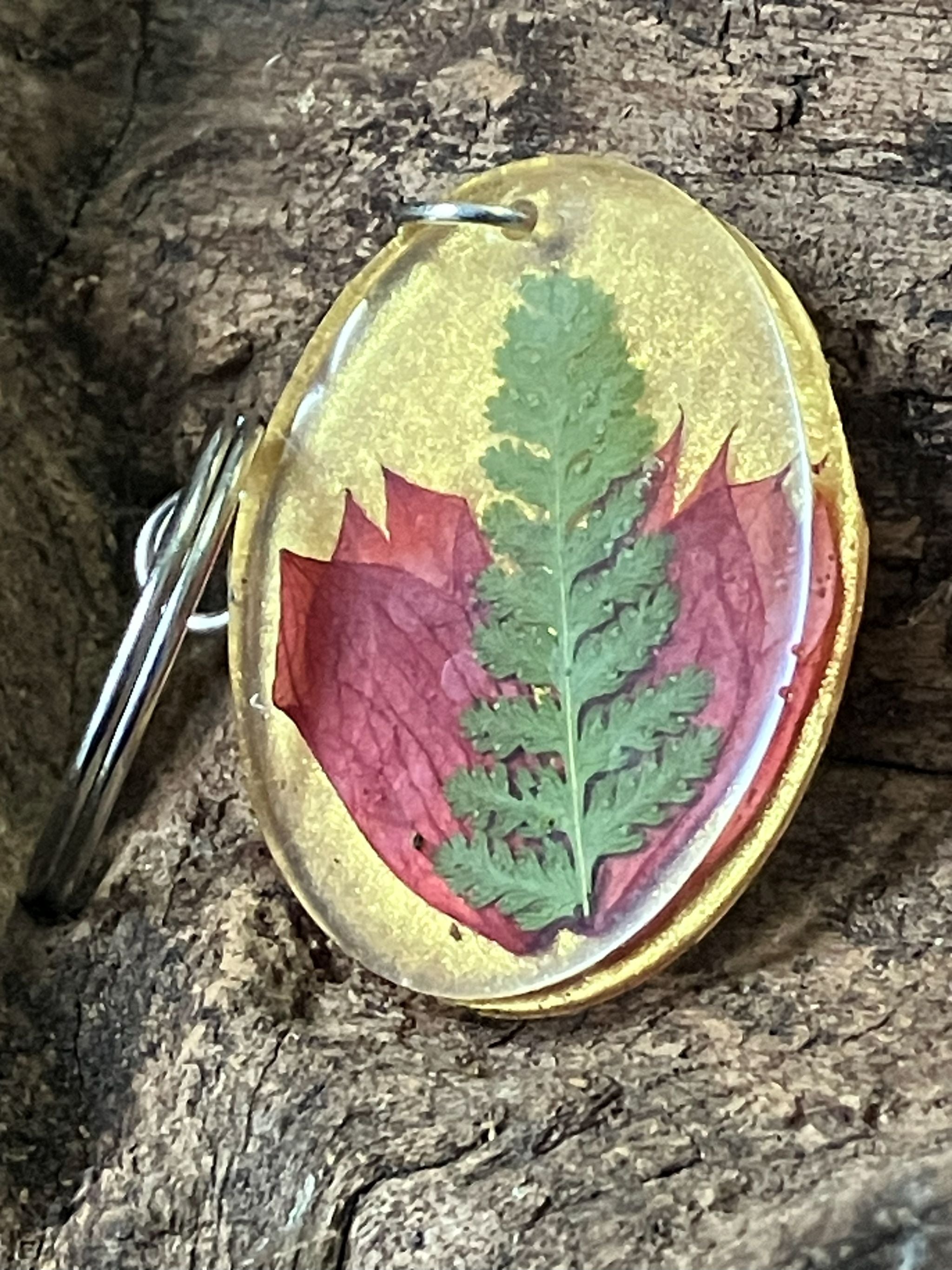 Gold resin keychain with real fern and salvia flowers preserved inside, handcrafted by R & D Floral.